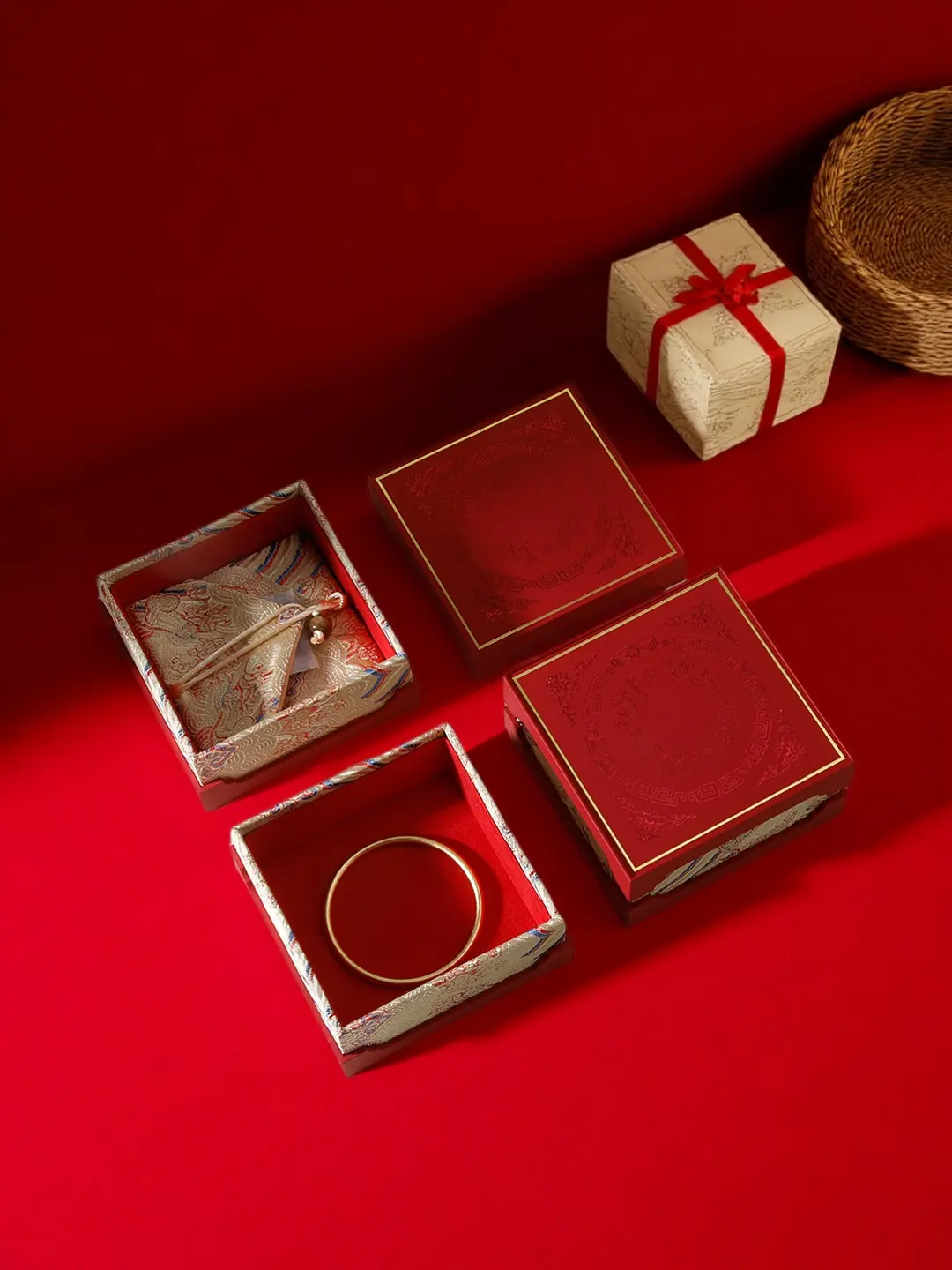 Chinese festive jewelry gift box lids face-up with brocade-lined interiors