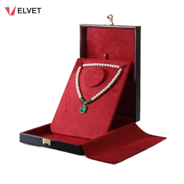 Wine red parure necklace set presentation box with fold-out suede cover holding a pearl and jade necklace set