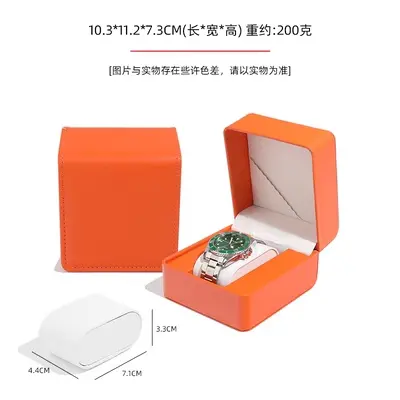 Open rounded-corner watch box showing cream cushion pillow and watch interior