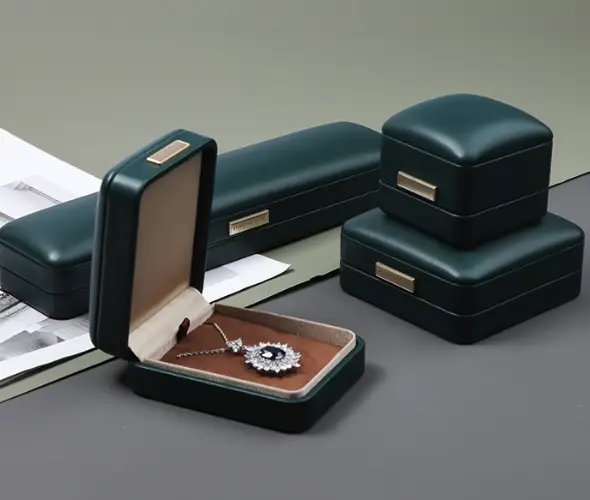 Green custom jewelry box collection used for a brand packaging story