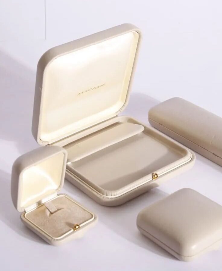 custom jewelry packaging — range of cream PU leather rigid ring and pendant boxes