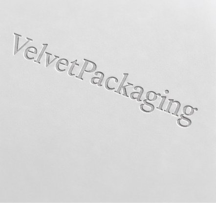 Embossed silver logo on white jewelry packaging material