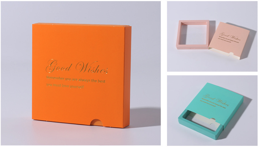 low moq jewelry boxes — orange, pink and teal paper drawer boxes with a gold foil logo