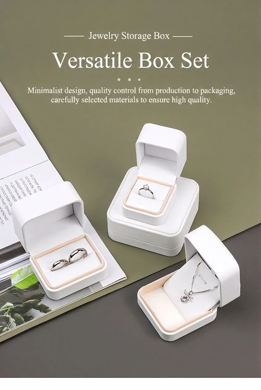 Minimalist versatile rounded PU leather jewelry box set - ring, couple's ring, and pendant boxes open on cream suede pads