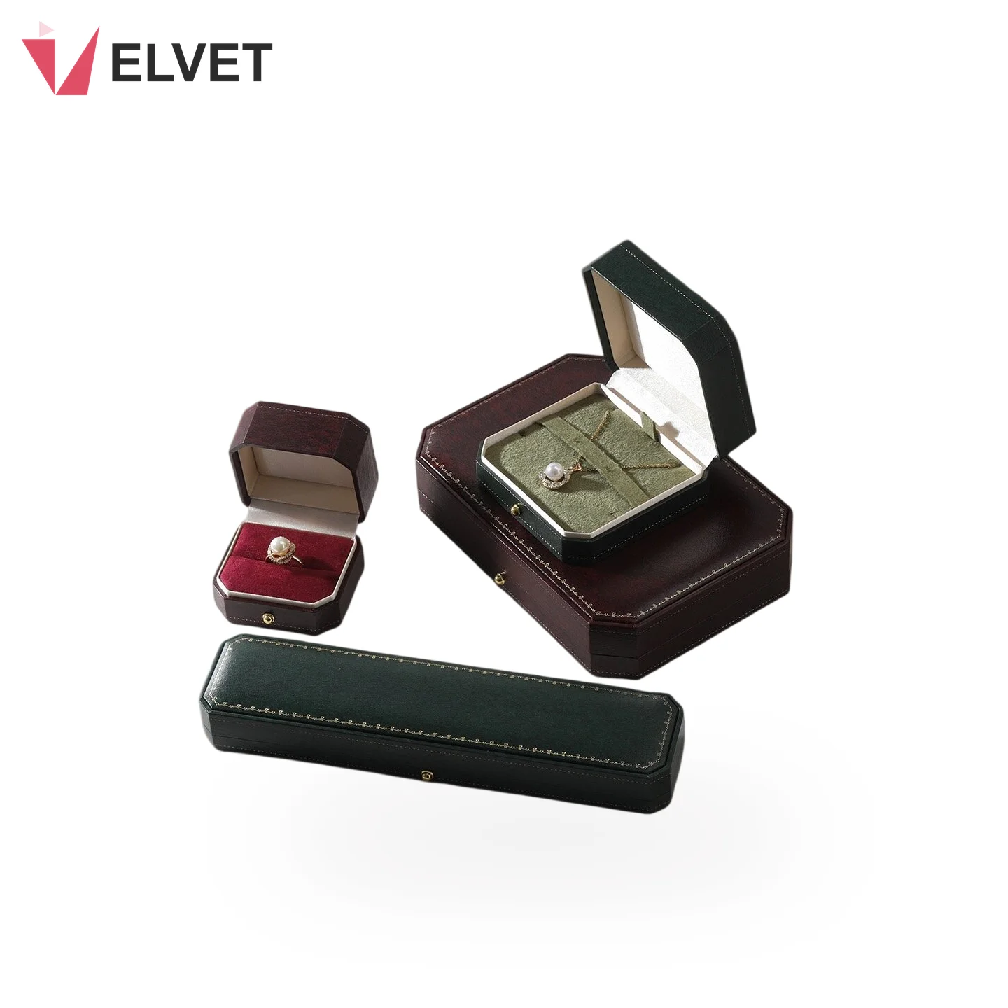 Vintage octagonal PU leather jewelry box set in wine red and green - a ring box and pendant box open with a pearl ring and pendant, beside a long green bracelet box
