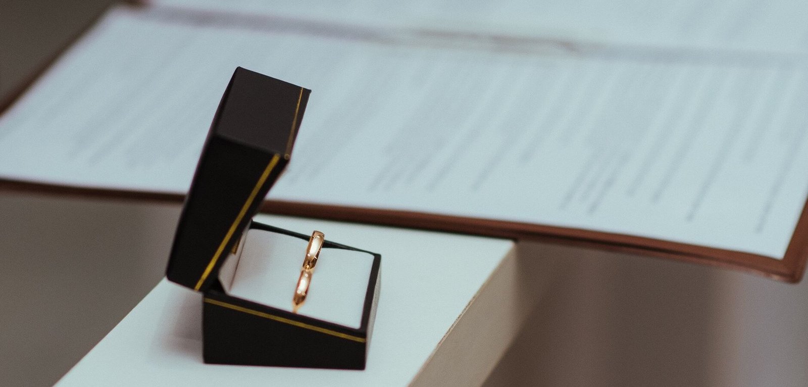 custom ring boxes wholesale — ring box presenting a gold wedding band
