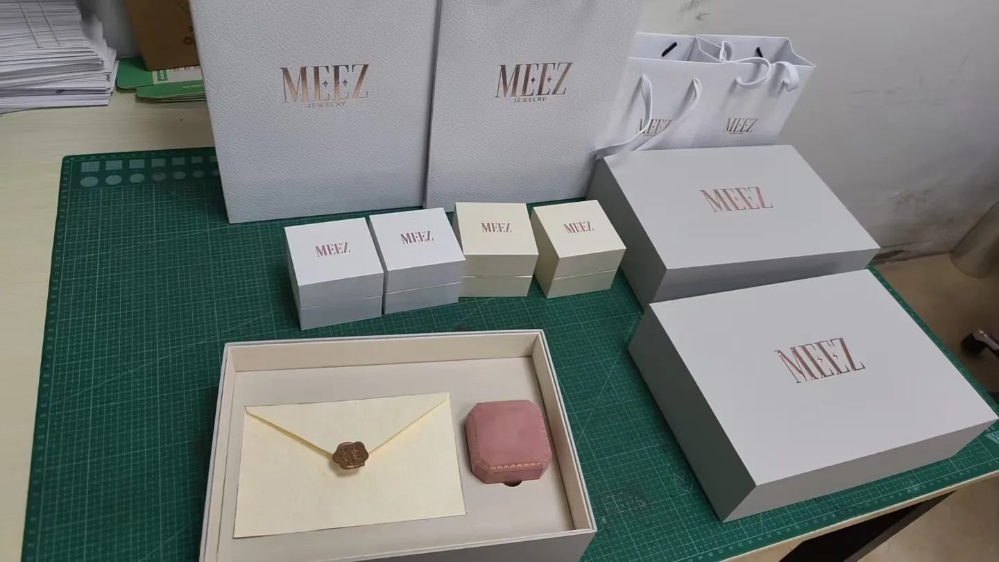 Custom jewelry packaging sample set with logo boxes and paper bags